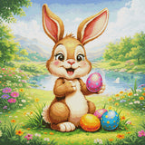 Cheerful bunny holding a colourful Easter egg in a meadow. Size - 100cm x 100cm