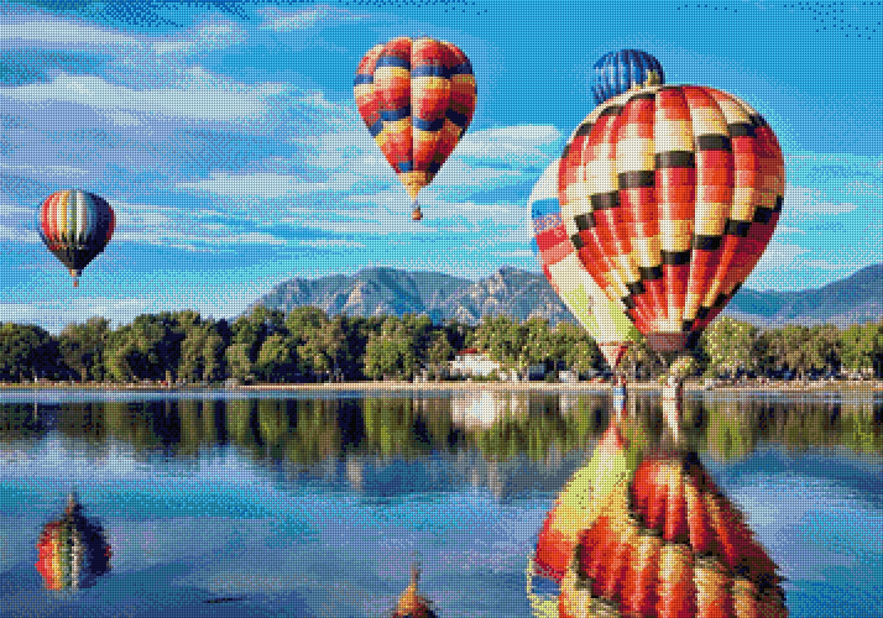 colourful hot air balloons reflecting on a lake with mountains in the background. Size - 100cm x 70cm