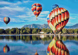 colourful hot air balloons reflecting on a lake with mountains in the background. Size - 100cm x 70cm