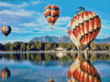 colourful hot air balloons reflecting on a lake with mountains in the background. Size - 40cm x 30cm