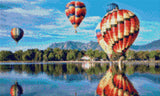 colourful hot air balloons reflecting on a lake with mountains in the background. Size - 50cm x 30cm