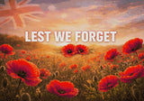 Field of red poppies with 'LEST WE FORGET' text under a sunrise sky. Size - 100cm x 70cm