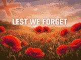 Field of red poppies with 'LEST WE FORGET' text under a sunrise sky. Size - 40cm x 30cm