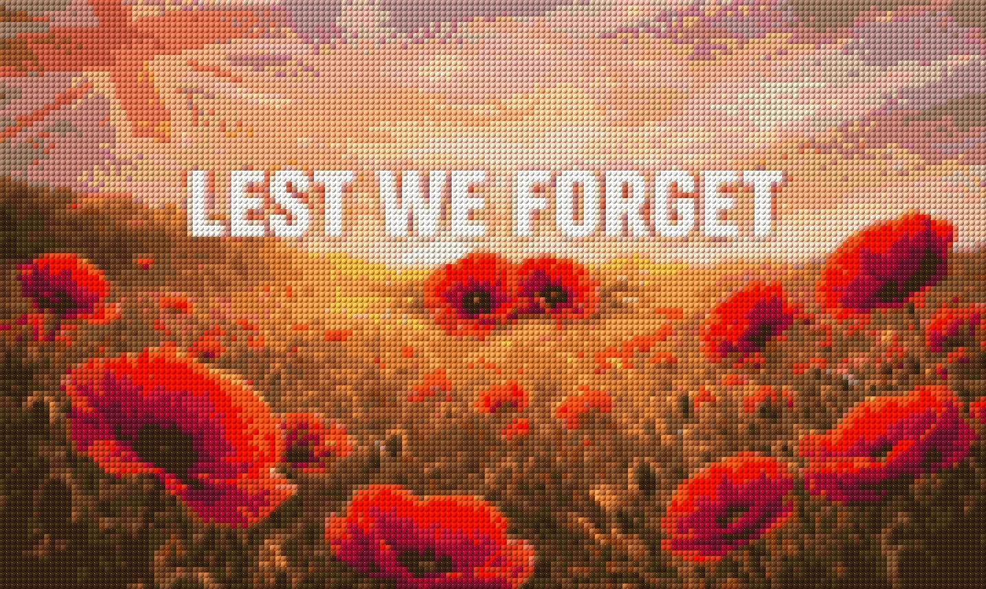 Field of red poppies with 'LEST WE FORGET' text under a sunrise sky. Size - 50cm x 30cm