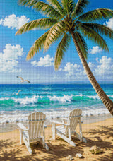 Two chairs on a sandy beach under a palm tree, facing the sea. Size - 70cm x 100cm
