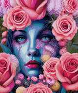 A blue-skinned face surrounded by pink roses, with striking blue eyes. Size - 50cm x 60cm