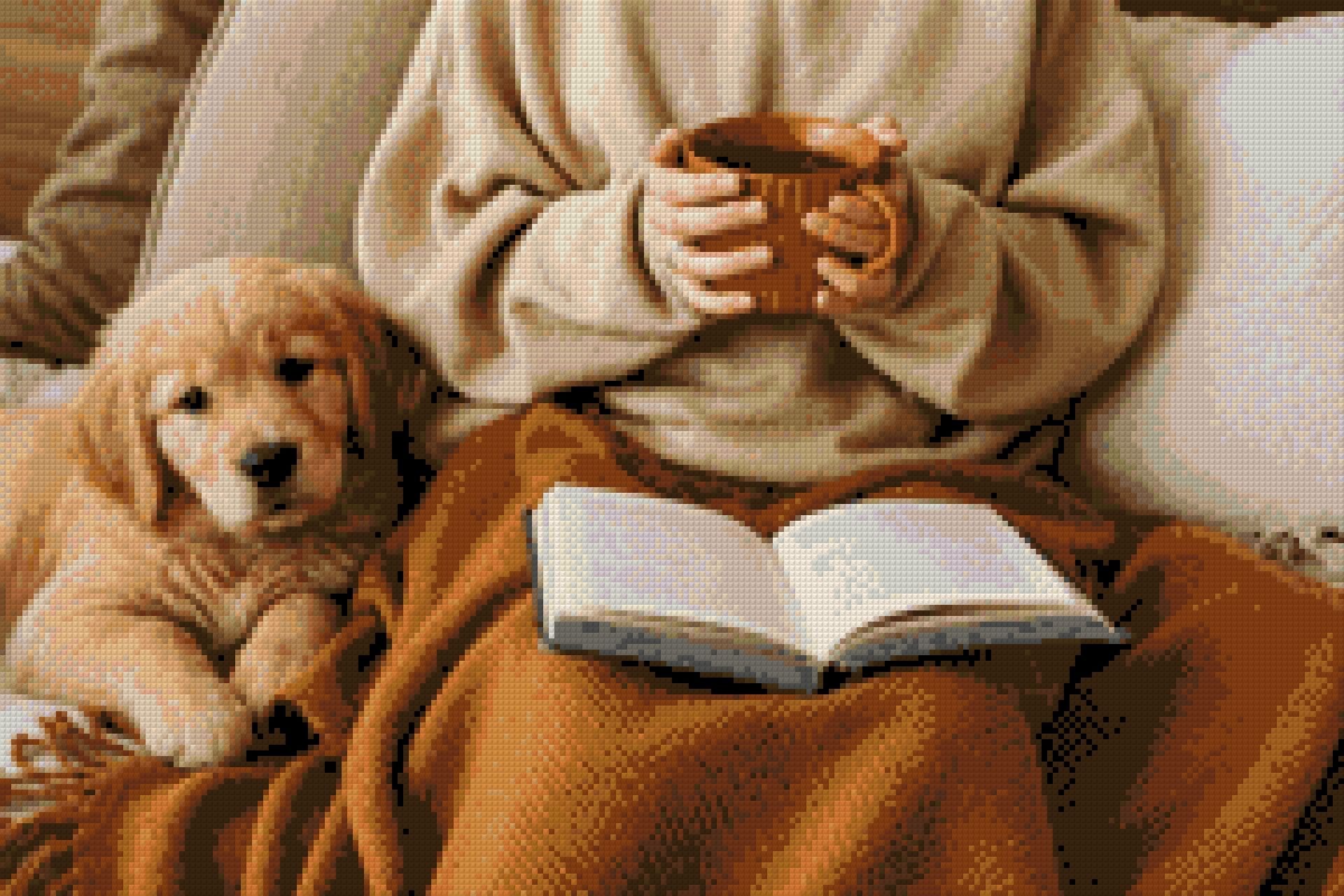 Person holding a mug with a puppy and an open book on a blanket. Size - 60cm x 40cm