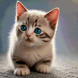 A kitten with striking blue eyes looks curiously ahead. Size - 60cm x 60cm